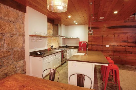 The barn's old stone walls are 3 feet thick. The reclaimed Douglas planks used for the walls and ceiling look especially warm and luxurious next to the old stone wall. 