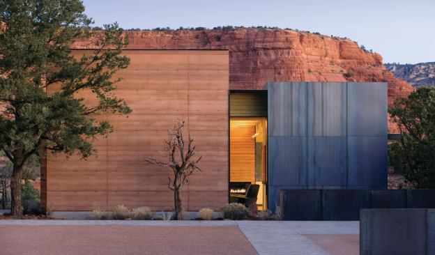 The Perch’s exterior massing is a composition of blocklike forms rendered in rammed earth, raw steel, and resawn Douglas fir.