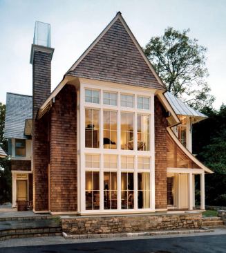 Set at the end of a long driveway, the Rye Residence's exaggerated roofline responds to its deep, narrow lot and its Victorian neighbors.