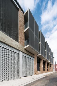 Five stacked balconies project from the west elevation.