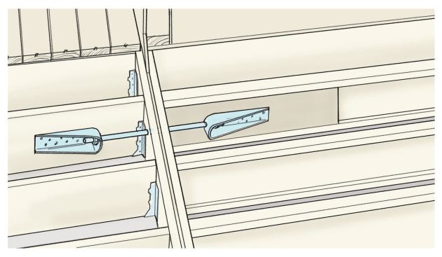 If the I-joists are parallel to the deck joists, you’ll have to fasten a 36-inch-long piece of 2-by stock to the I-joist web before installing lateral-load brackets. The 2-by should be attached with 15 10d nails, with the protruding points clinched over.