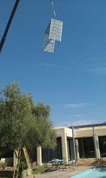 The steel pieces of the canopy and the steel shade boxes for the theater room were lifted into place with a crane.