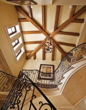 In houses designed to impress, the entry plays an especially important role. This elaborate Mediterranean-style stair hall exemplifies the high level of finish work devoted to such spaces.