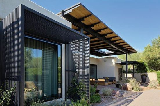 A small, side porch off the master bedroom  provides a more private outdoor setting for the owner.

