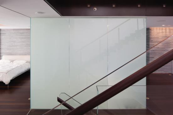 Electric privacy glass permits modesty at the touch of a switch.