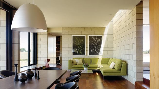 Sandblasted concrete block becomes both an interior and exterior finish material.
