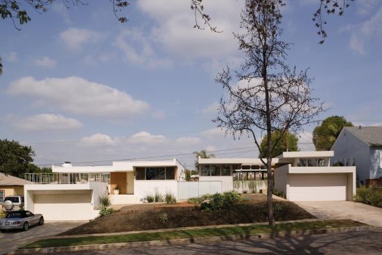 The house, right, sits adjacent to another home designed by Schindler. 