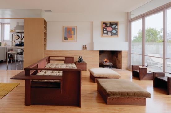 Living room after. Custom kitchen cabinets are made of layered maple plywood with a laminate skin.

