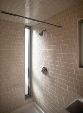 All non-floor tile in the bathroom shower was purchased for $100 from factory extras.