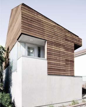 Cutouts in the building volume create sheltered outdoor spaces.