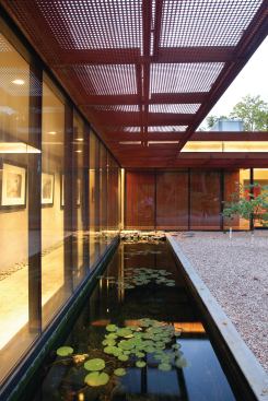 Some of the panels are hung horizontally instead of vertically to form a brise soleil.