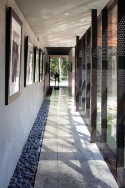 A window at the end of each long hall literalizes the concept of “view corridor.”