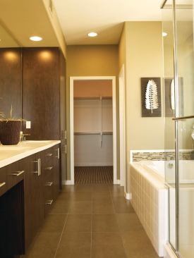 Spacious bathrooms lead to large walk-in closets.