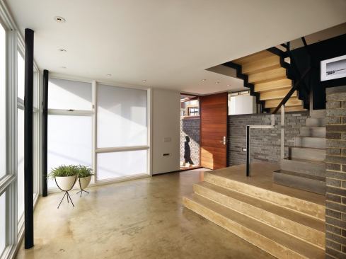 The exterior brick wall continues into the foyer.