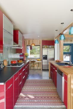 The slab-on-grade construction has simple concrete floors that are warmed by radiant heat. 