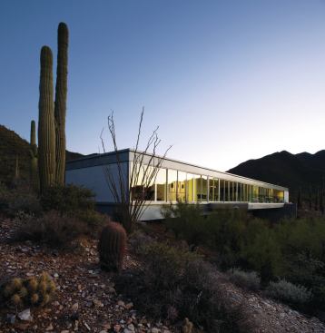 Tight construction and clever orientation prevent this glass house from suffering from heat gain. 