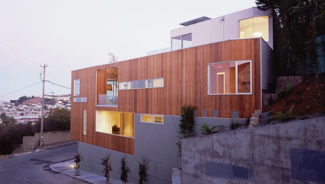 Cutouts weave outdoor spaces into the volume of the building.