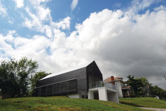 Louvers and a burned-wood skin clad the Prescott Passive House's exteriors.