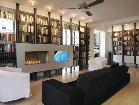 2011 RADA  Merit Award, Architectural Detail  McInturff Architects, Bethesda, Md.   McInturff Architects designed custom modular shelving that works within the existing walls of this Washington, D.C., house. In the living room, the bookshelves also support an aluminum-framed box containing a gas fireplace and a flat-screen TV.