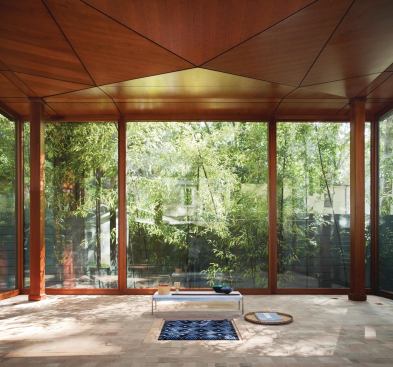 The floor is made from the exposed end blocks of vertical-grain Douglas fir. The ceiling folds down in the middle, like a dreidel, and echoes the steel cross-bracing.