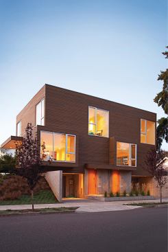 To capture natural light, this duplex stretches on an east-west axis and elevates its main living spaces above street level.