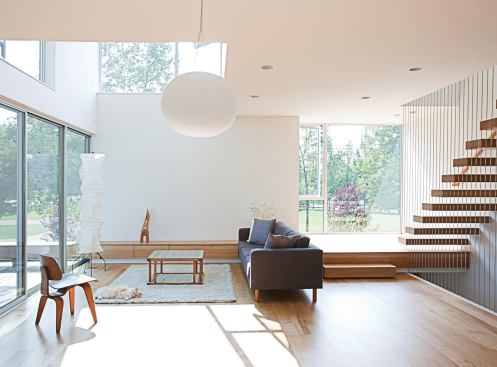 Windows and doors hug the corners of the building, maximizing reflected light within.


