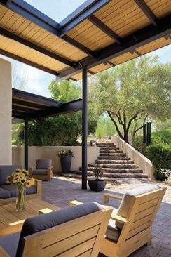 The canopy structure is made of steel and rough-hewn Douglas fir. It ties in to the new masonry and landscaping.