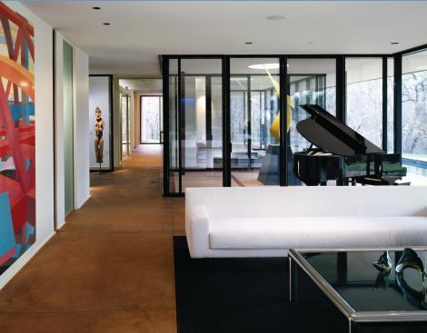 A flame sculpture anchors a covered indentation in the entry hall. 
