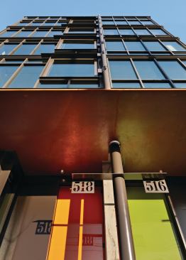 Brightly colored doors create a sense of interest at the street level.