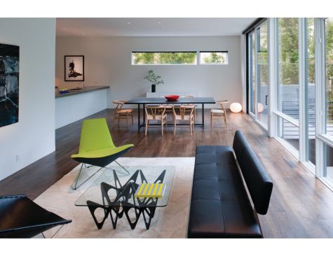 Walnut flooring anchors the white walls and millwork.

