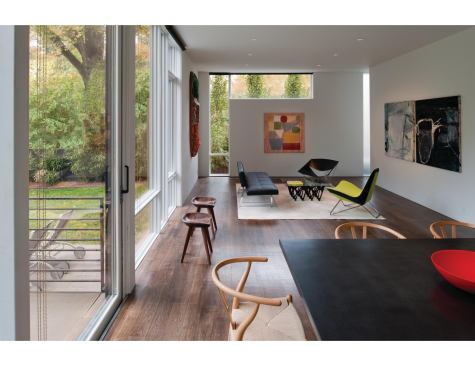 Bright white interiors are juxtaposed with a charcoal-gray exterior.