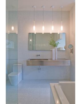Crisp detailing complements the white-on-white master bath.

