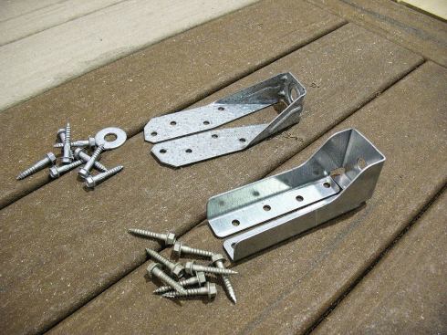 The two most common galvanized-steel lateral-load brackets are Simpson’s DTT-2Z (top) and USP’s DTB-TZ (bottom). Both are sold with a 1/2-inch washer and structural joist-attachment screws. You’ll need a pair of brackets to make one connection, and will have to supply the threaded rod or bolt and nuts to join them together.