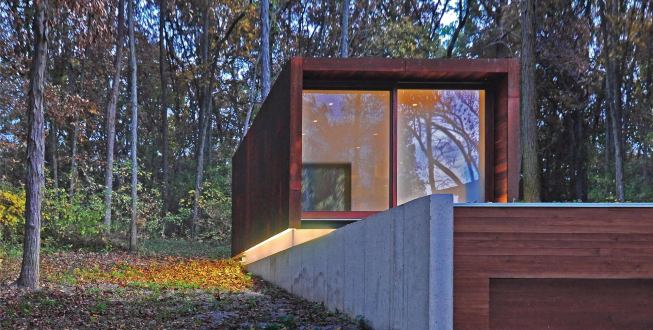 Tucked into the hillside, the lower level contains equipment storage space.