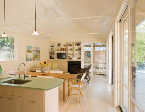 The light colors and straightforward detailing of the interiors emphasize the home's identity as a relaxed, low-maintenance beach house.