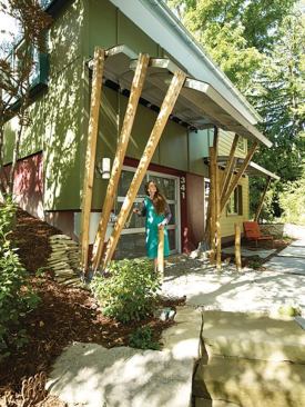One of the first things guests see as they approach from the gravel drive is an articulated awning that is both functional and a work of moveable art. (This awning won a 2010 Remodeling Design Awards Merit award in the Detail category.) 