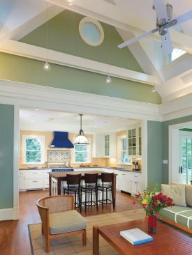 The single-story addition is made up of a new kitchen, family room, and breakfast room spaces that are open to one another yet subtly subdivided. The kitchen and family room are housed within a new gabled structure. 