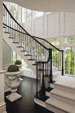 The structure features custom mahogany newel posts.