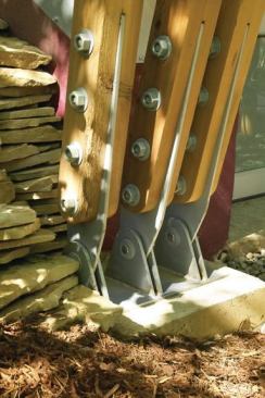 This detail of the awning's mechanicals shows the articulating structural posts fabricated from recycled telephone poles.