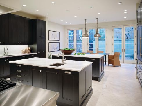 This kitchen remodel has a classic contemporary design that fits this 100-year-old Philadelphia brownstone. Traditional ebony stained cabinets mix with stainless steel appliances.