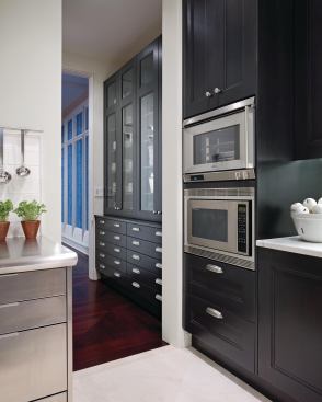 The nearby butler's pantry holds an extensive collection of china, glassware, and silverware.