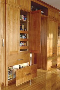 The refrigerator and under-counter combination drawers are seamlessly integrated into customized cabinetry.