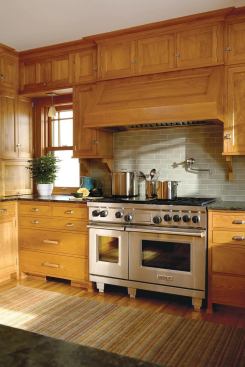 The utilitarian form of the range and hood liner complement the history of the house while transcending style. "We like using Wolf and Sub-Zero products," says designer David Heide. "They are as permanent an addition to the kitchen as the kitchen is to the house."