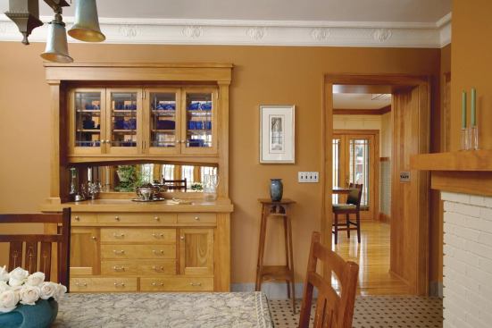 The new historically inspired buffet is the highlight of the dining room. Glass at back of the buffet further connects the kitchen and dining room.