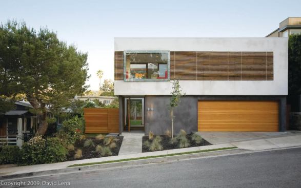 Designer Erla Ingjaldsdottir converted this five-unit apartment building into a single-family residence by remodeling less than 50% of the existing structure.
