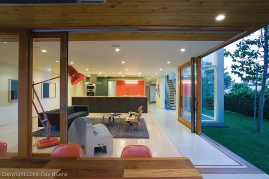 Large sliding glass doors in the living room and master bedroom provide natural ventilation and a connection to the outdoors. The house has solar thermal radiant heating under the floors, as well as a solar hot water heater.