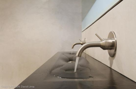 The bathroom sinks are made of a recycled rubber material.