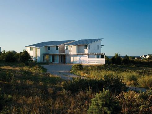The home's north side hunkers down under its standing-seam metal roof as a defense against harsh winds. 