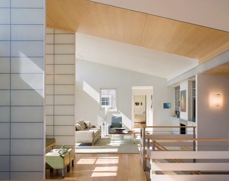 Kalwall panels enclose the sitting area at the top of the stairs.