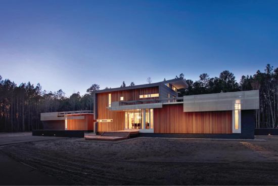 Merit Award - Custom Home / 3,000 to 5,000 Square Feet

GREENville House, Greenville, N.C.



Tonic Design, Raleigh, N.C.



This LEED Silver-rated North Carolina house takes a contemporary approach to integrating architecture and sustainability. Aluminum rooftop “trays” provide integrated mounting for photovoltaic and solar thermal panels, turning down at the roof's edge to shade the windows. The house's low-maintenance shell combines brick-, red cedar-, and zinc-clad forms in an interlocking composition.